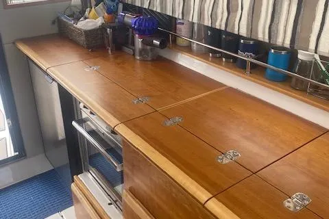  Yacht Photos Pics 2020 Cutwater C-32 C interior with wooden countertop and storage.