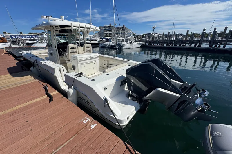  Yacht Photos Pics 2019 Boston Whaler 330 Outrage docked at marina with twin outboard engines.