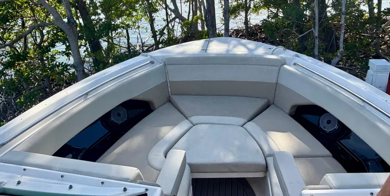  Yacht Photos Pics 2020 Boston Whaler 280 Vantage boat interior with cushioned seating and scenic background.