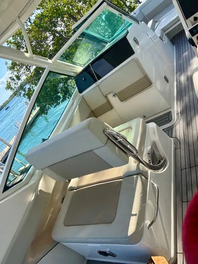  Yacht Photos Pics 2020 Boston Whaler 280 Vantage interior with seating and water view.