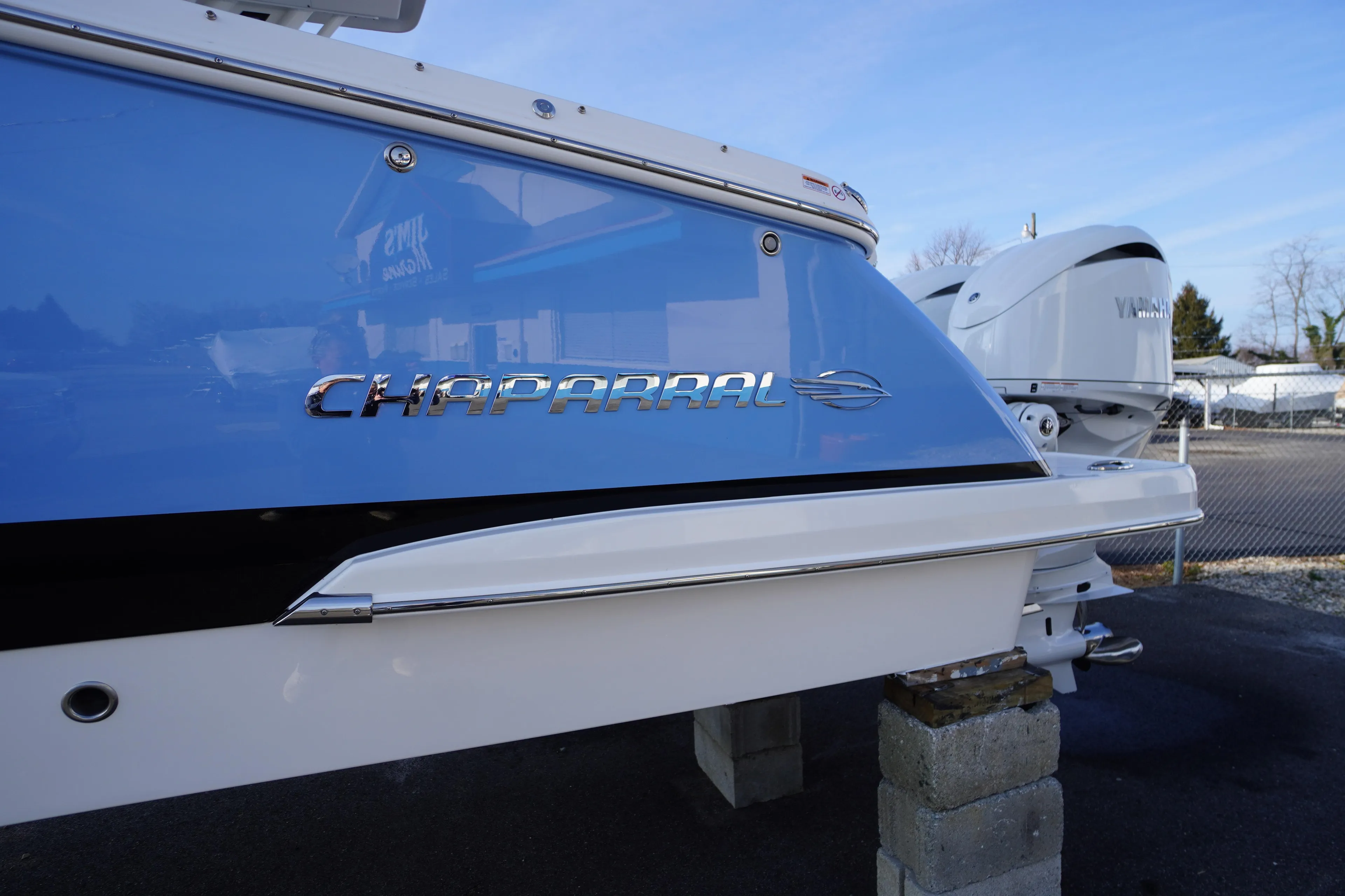2026 Chaparral 280 OSX boat with Yamaha engine, displayed outdoors.