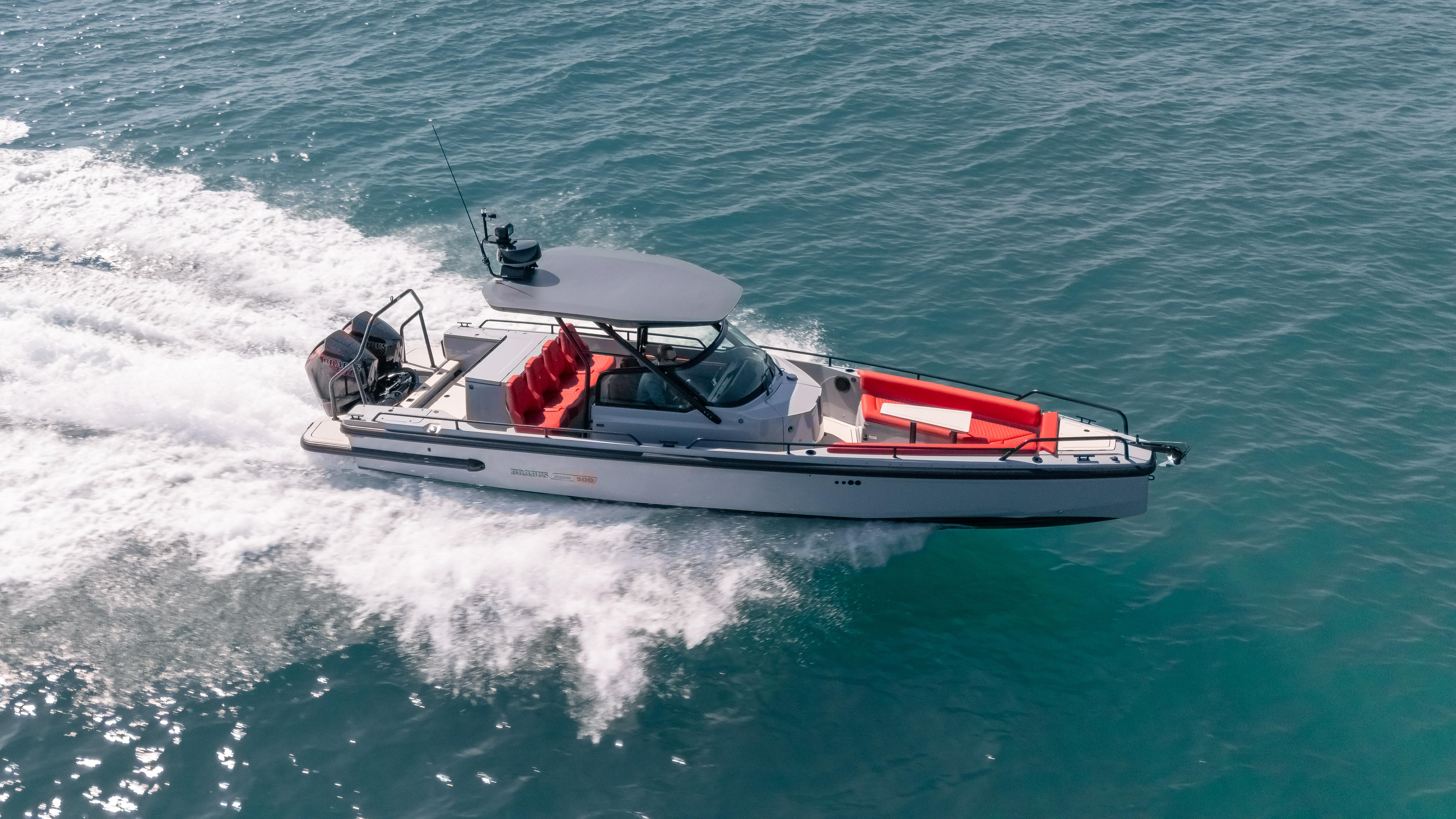 2023 BRABUS Shadow 500 T-Top boat cruising on open water.