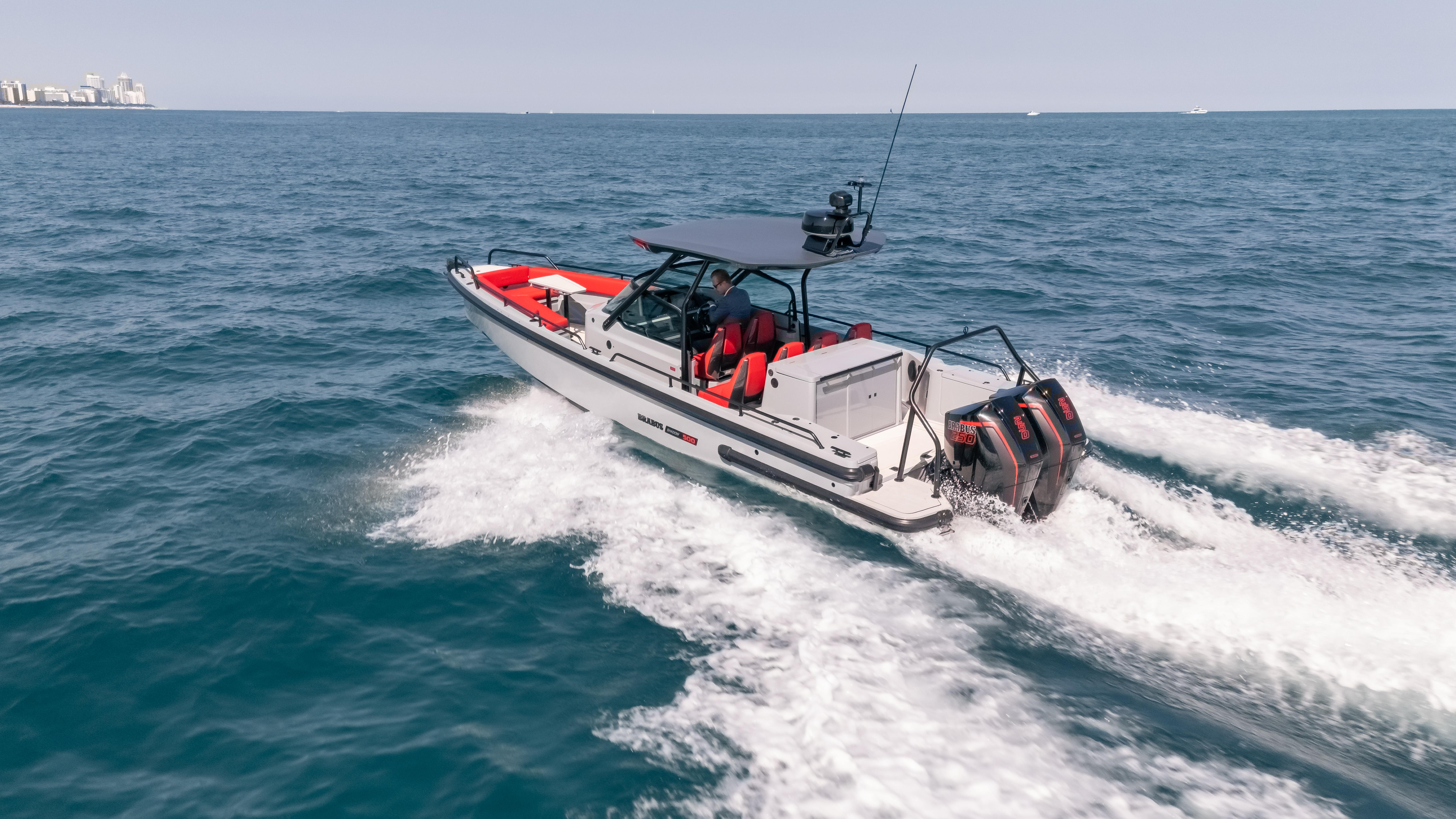 2023 BRABUS Shadow 500 T-Top cruising on open sea, showcasing sleek design and powerful engines.