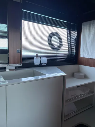 4946 Yacht Photos Pics Luxurious bathroom interior of 2023 Riva 56 Rivale yacht with modern fixtures.