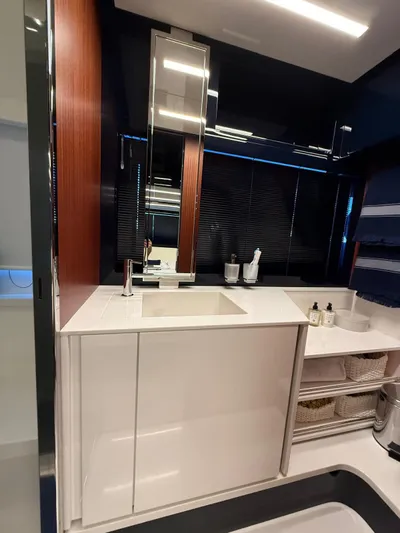 4946 Yacht Photos Pics Luxurious bathroom interior of 2023 Riva 56 Rivale yacht with modern sink and storage.