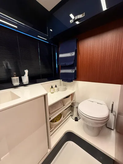 4946 Yacht Photos Pics Luxurious bathroom in 2023 Riva 56 Rivale yacht, featuring modern fixtures and elegant design.