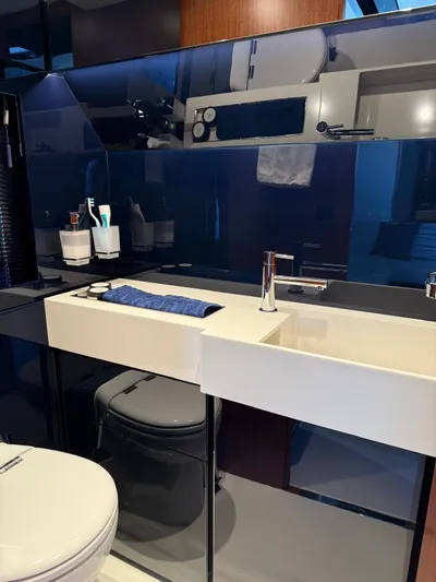 4946 Yacht Photos Pics Luxurious bathroom interior of 2023 Riva 56 Rivale yacht with modern sink and fixtures.
