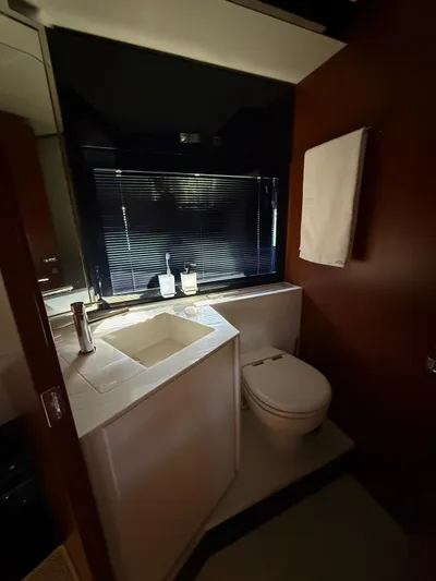 4946 Yacht Photos Pics Luxurious bathroom in 2023 Riva 56 Rivale yacht with modern fixtures and elegant design.