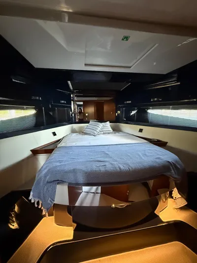 4946 Yacht Photos Pics Luxurious bedroom interior of 2023 Riva 56 Rivale yacht with elegant bedding.