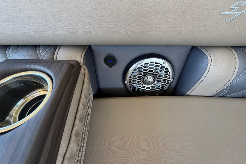  Yacht Photos Pics 2024 Bennington 25 QX Swingback interior with speaker and cup holder detail.