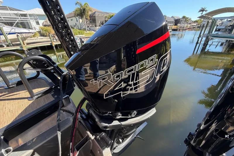  Yacht Photos Pics 2024 Bennington 25 QX Swingback with powerful Racing 450 engine by the water.