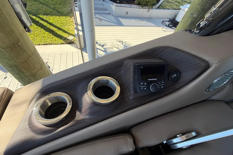  Yacht Photos Pics 2024 Bennington 25 QX Swingback console with cup holders and USB port.