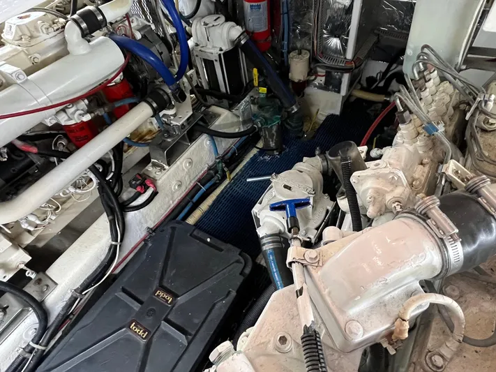 Journey Yacht Photos Pics Engine room of 1999 Ocean Alexander Sundeck 460, showcasing mechanical components and piping.