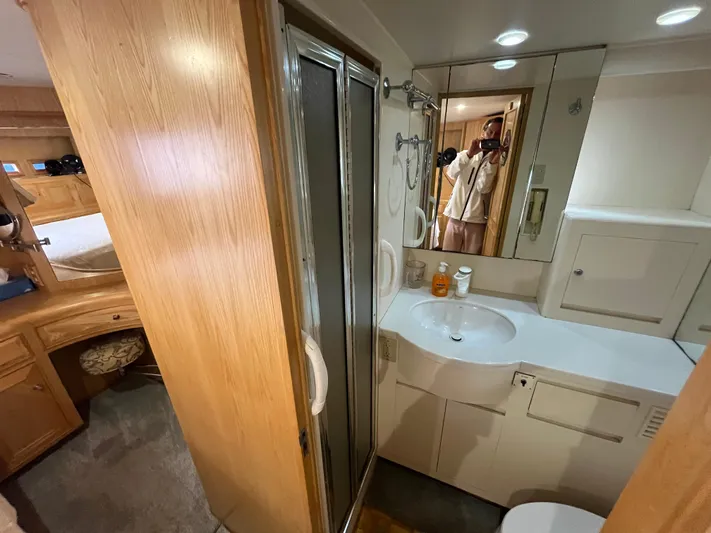 Journey Yacht Photos Pics Bathroom interior of 1999 Ocean Alexander Sundeck 460 yacht with shower and vanity.