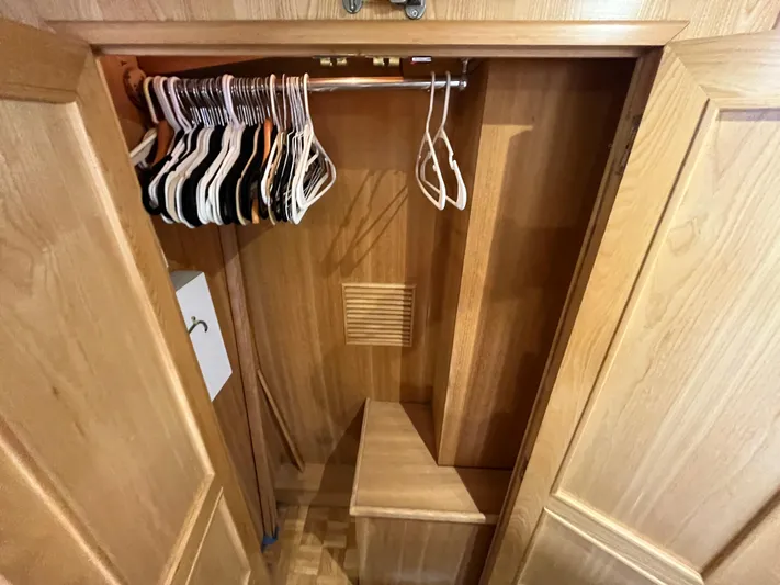 Journey Yacht Photos Pics Wooden closet interior with hangers, part of a 1999 Ocean Alexander Sundeck 460 yacht.