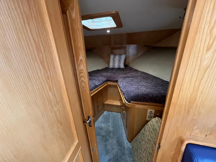 Journey Yacht Photos Pics Cozy cabin interior of 1999 Ocean Alexander Sundeck 460 yacht with wooden finish.