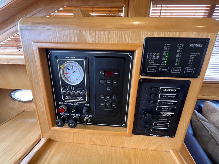 Journey Yacht Photos Pics Control panel of a 1999 Ocean Alexander Sundeck 460 yacht, featuring various switches and gauges.