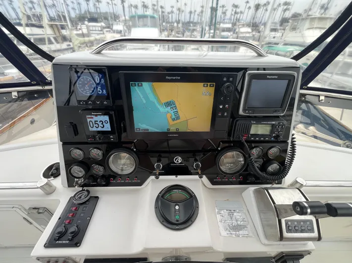 Journey Yacht Photos Pics Cockpit of 1999 Ocean Alexander Sundeck 460 with navigation instruments and controls.