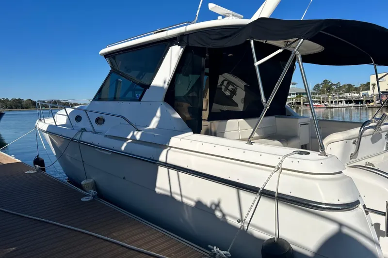  Yacht Photos Pics 1999 Tiara Yachts 4000 Express docked, featuring sleek design and spacious deck.