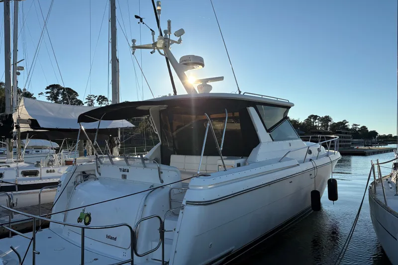  Yacht Photos Pics 1999 Tiara Yachts 4000 Express docked at marina during sunset.