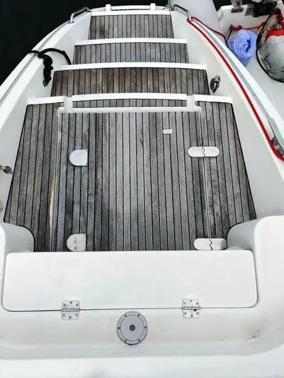  Yacht Photos Pics Lagoon 570 yacht deck, 2004 model, featuring wooden steps and white trim.