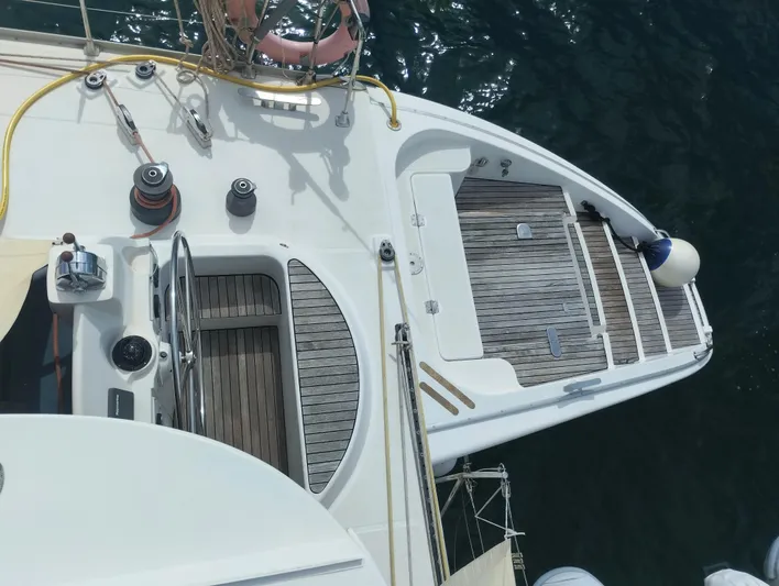  Yacht Photos Pics Aerial view of 2004 Lagoon 570 yacht deck with wooden flooring and nautical equipment.