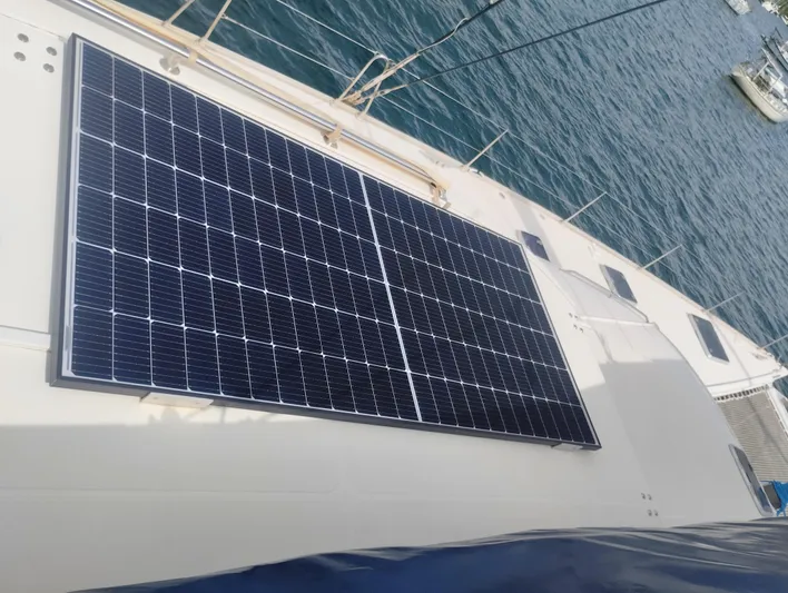  Yacht Photos Pics Solar panels on 2004 Lagoon 570 yacht deck, docked by the sea.