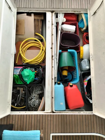  Yacht Photos Pics Storage compartments on a 2004 Lagoon 570 yacht filled with various boating supplies.
