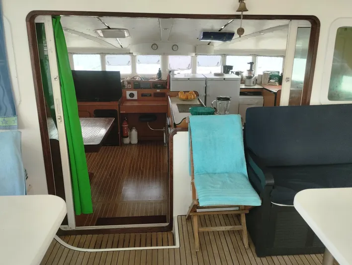  Yacht Photos Pics Interior of a 2004 Lagoon 570 yacht with seating and kitchen area.