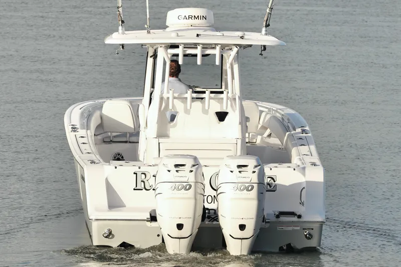  Yacht Photos Pics 2022 Sportsman Open 322 Center Console boat with twin 400 horsepower engines on water.