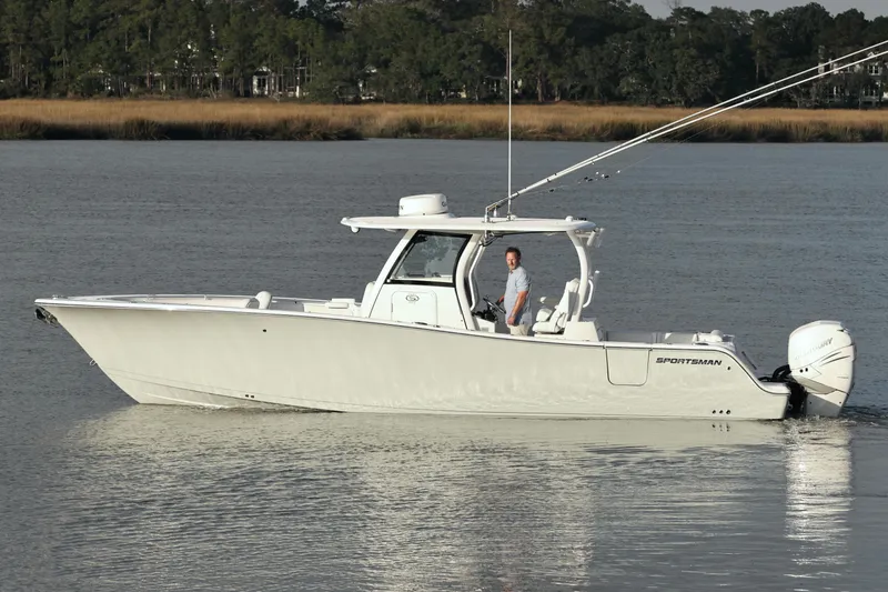  Yacht Photos Pics 2022 Sportsman Open 322 Center Console boat on calm water, side view.
