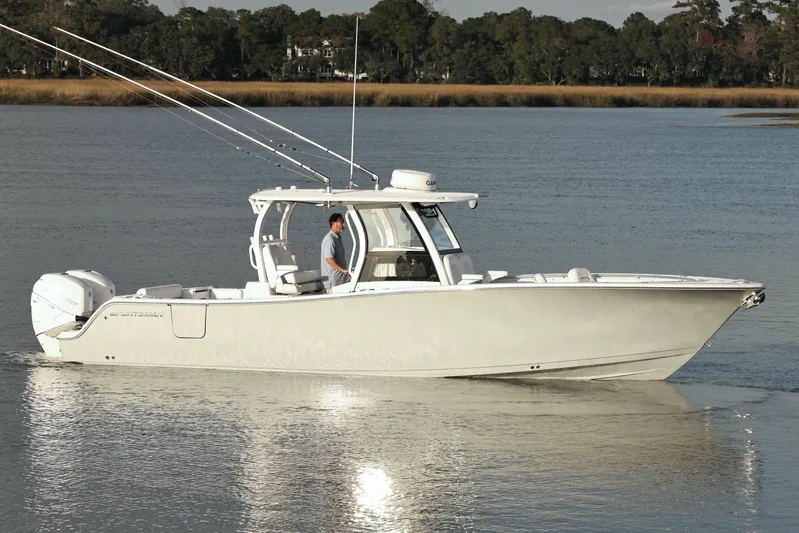  Yacht Photos Pics 2022 Sportsman Open 322 Center Console boat cruising on calm water.