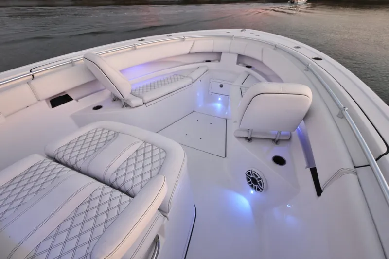  Yacht Photos Pics 2022 Sportsman Open 322 Center Console boat interior with cushioned seating and ambient lighting.