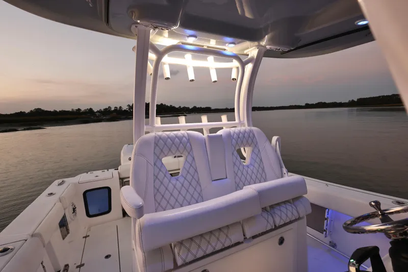  Yacht Photos Pics 2022 Sportsman Open 322 Center Console boat interior at sunset on calm water.