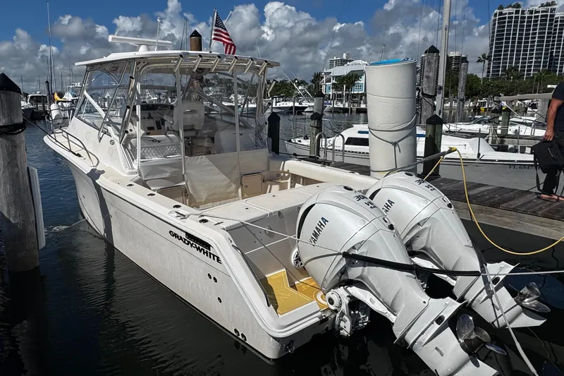  Yacht Photos Pics 2001 Grady-White Express 330 boat docked with twin Yamaha engines, marina background.