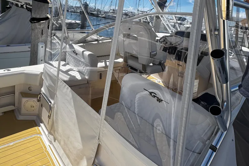  Yacht Photos Pics 2001 Grady-White Express 330 boat interior with seating and helm, docked at marina.