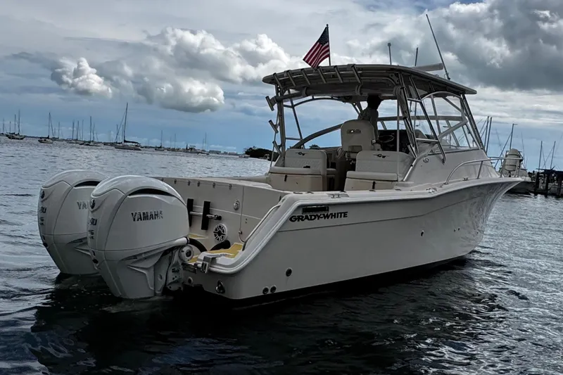  Yacht Photos Pics 2001 Grady-White Express 330 boat with twin Yamaha engines on a calm sea.