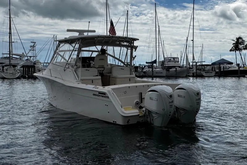  Yacht Photos Pics 2001 Grady-White Express 330 boat docked in marina with twin Yamaha engines.