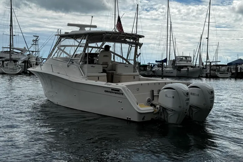  Yacht Photos Pics 2001 Grady-White Express 330 boat docked, featuring twin Yamaha engines, in a marina setting.