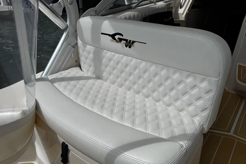  Yacht Photos Pics 2001 Grady-White Express 330 boat seat with quilted white upholstery.
