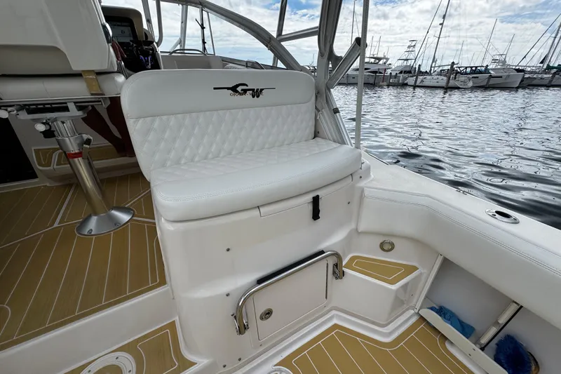  Yacht Photos Pics 2001 Grady-White Express 330 boat interior with white seating and wood-patterned flooring.