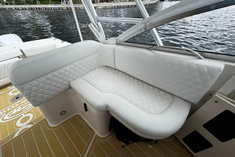  Yacht Photos Pics Luxurious seating on 2001 Grady-White Express 330 boat, featuring quilted white upholstery.