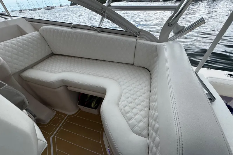  Yacht Photos Pics Luxurious seating on 2001 Grady-White Express 330 boat with quilted upholstery and scenic water view.