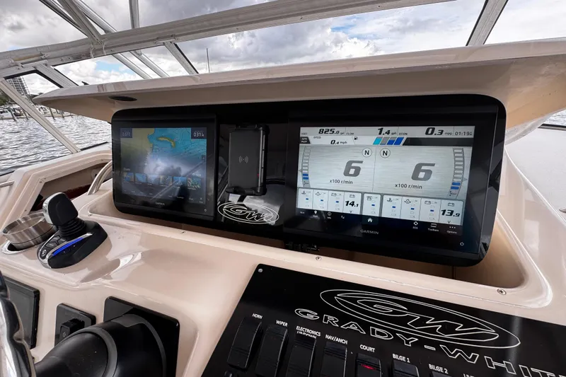  Yacht Photos Pics Dashboard of a 2001 Grady-White Express 330 boat with modern navigation displays.