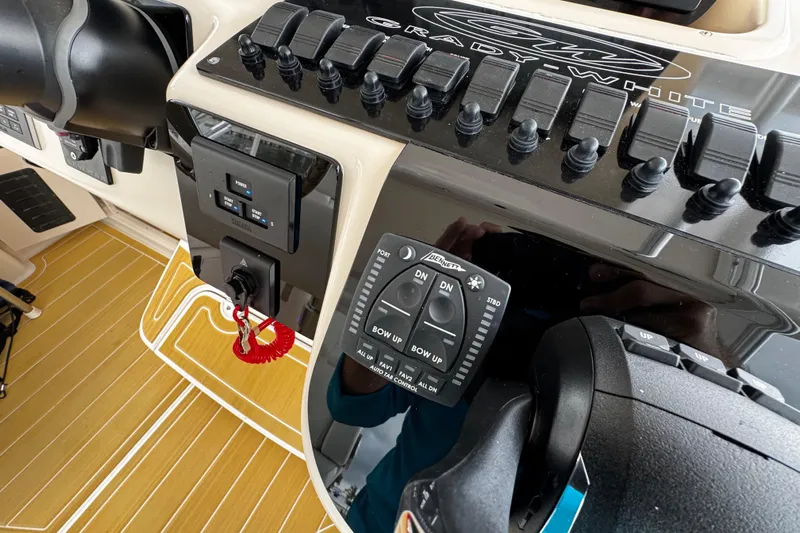  Yacht Photos Pics Control panel of a 2001 Grady-White Express 330 boat with switches and throttle.