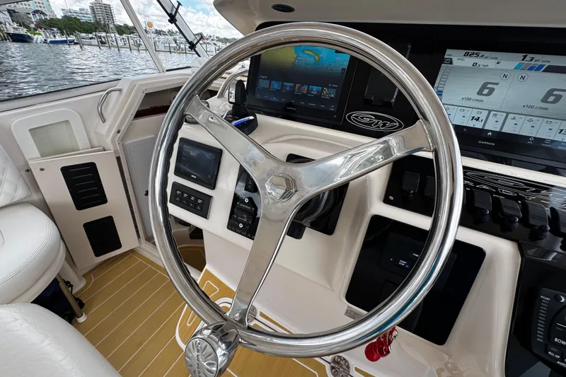  Yacht Photos Pics Helm of 2001 Grady-White Express 330 with modern navigation displays and controls.