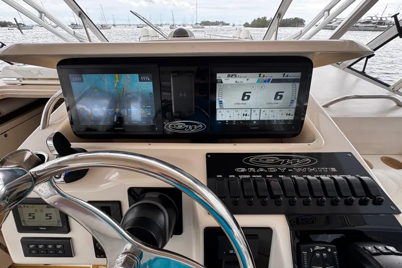  Yacht Photos Pics Control panel of a 2001 Grady-White Express 330 boat with navigation screens.