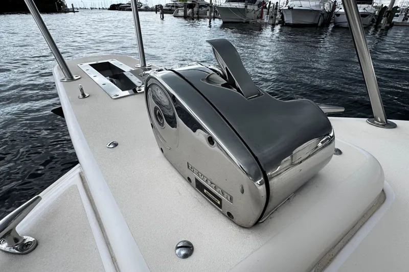  Yacht Photos Pics 2001 Grady-White Express 330 boat with a chrome anchor winch on deck.