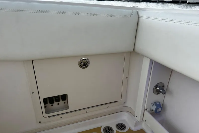  Yacht Photos Pics 2001 Grady-White Express 330 boat interior, featuring storage compartment and seating area.