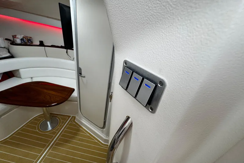  Yacht Photos Pics Interior of 2001 Grady-White Express 330 boat with modern switches and seating area.